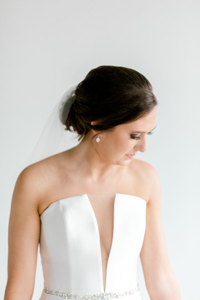 Rachel Bridal Portraits at the Lumen Room Dallas | Elegant & Classic Bride | Strapless White Dress with Belt | Elegant Bridal Updo | Dallas Wedding Photographer | Sami Kathryn Photography